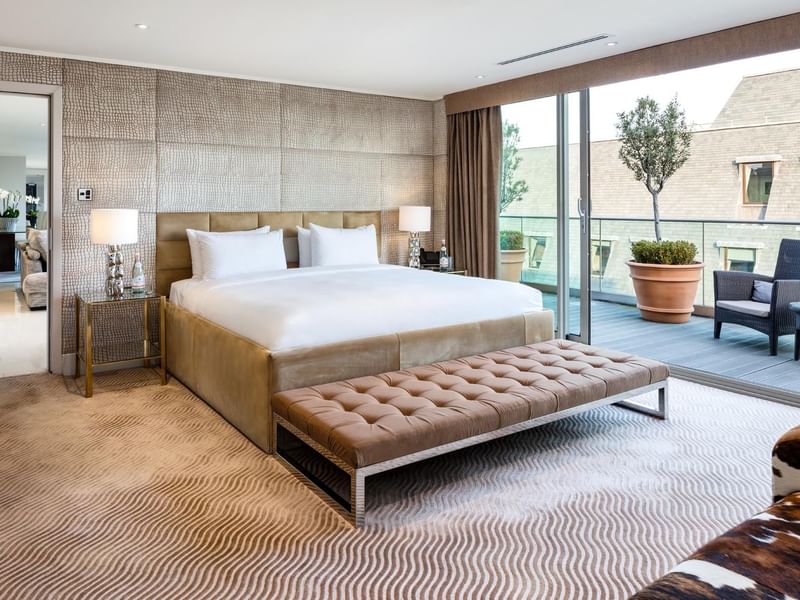 Interior of a bedroom with king bed at May Fair Hotel London