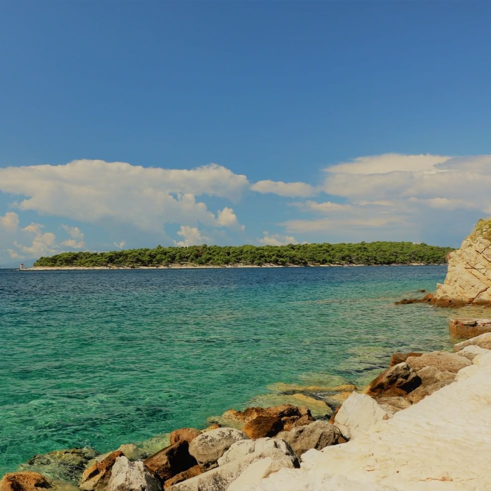 View of Rab Island on a sunny day near Falkensteiner Hotels