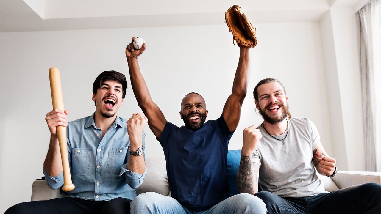 Three friends cheering for a game in Pullman, Washington.
