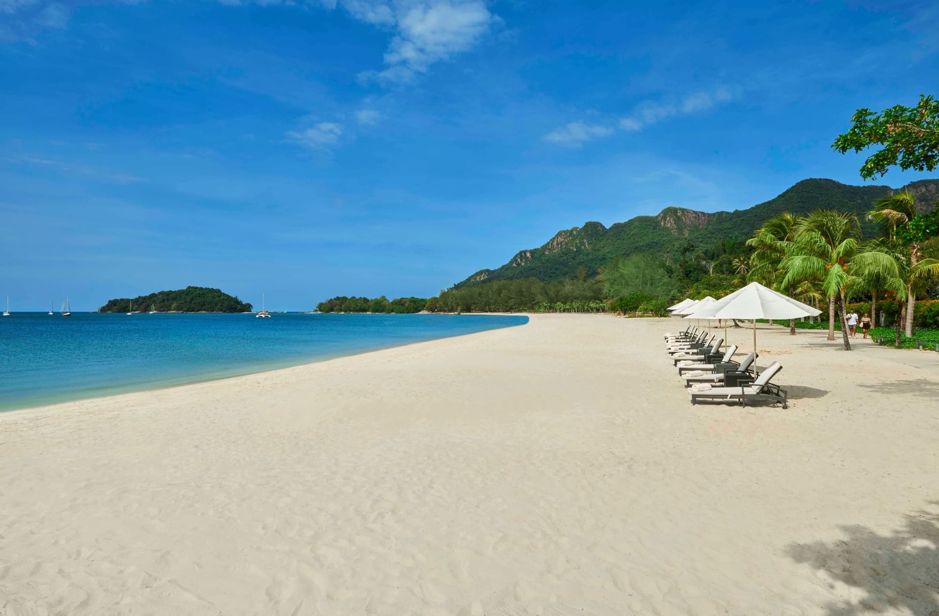 Landscape view of the beach with sunbeds at The Danna Langkawi