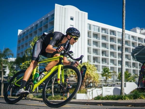 Cyclist riding around street in Cairns