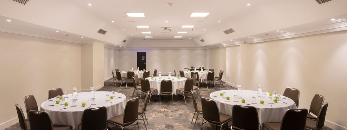 Hibiscus Conference Room with set up banquets at Novotel Sydney International Airport 