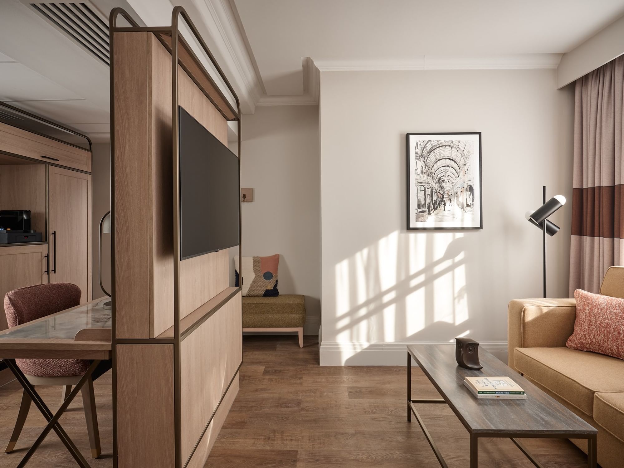 Modern Family Room living area with sofa, coffee table, and wood partition wall at The Met Hotel Leeds, England