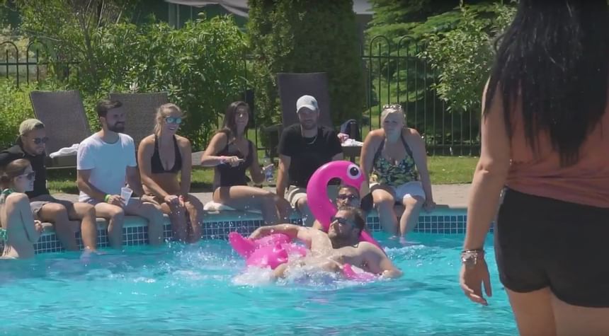 People enjoying in the pool at Hotel Mont Gabriel Resort & Spa