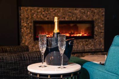 Champagne in front of fireplace in the Earl Suite