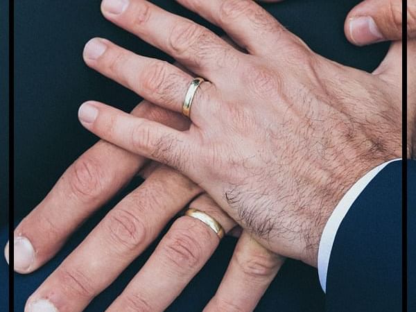 Close-up of hands with their wedding bands at Pullman & Mercure Brisbane King George Square