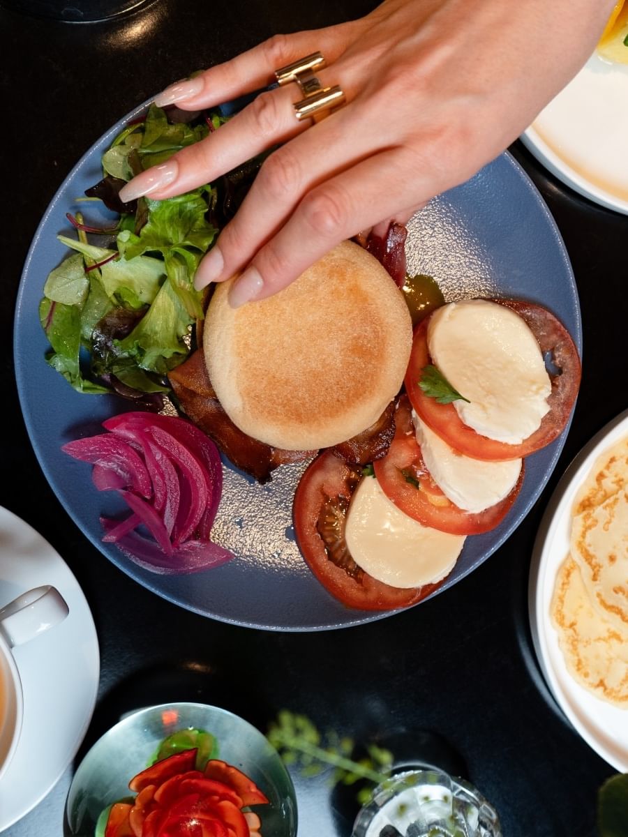 Breakfast muffin with mozzarella and tomato in Breakfast & 24-Hour Room Service at Warwick Paris Champs Elysées