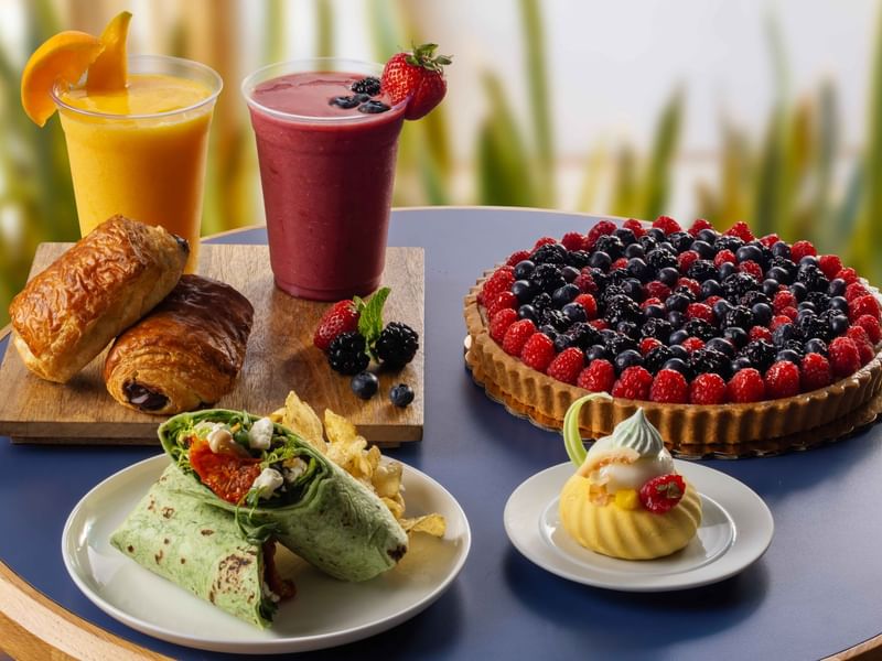 Assorted pastries and sweets served with smoothies at The Press, The Diplomat Resort