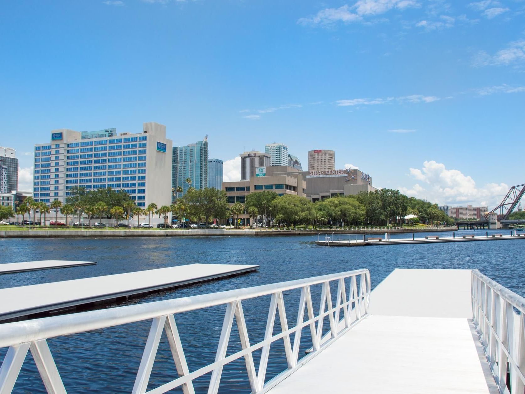 Pier with a city skyline in the background in eBOATS TAMPA near The Barrymore Hotel