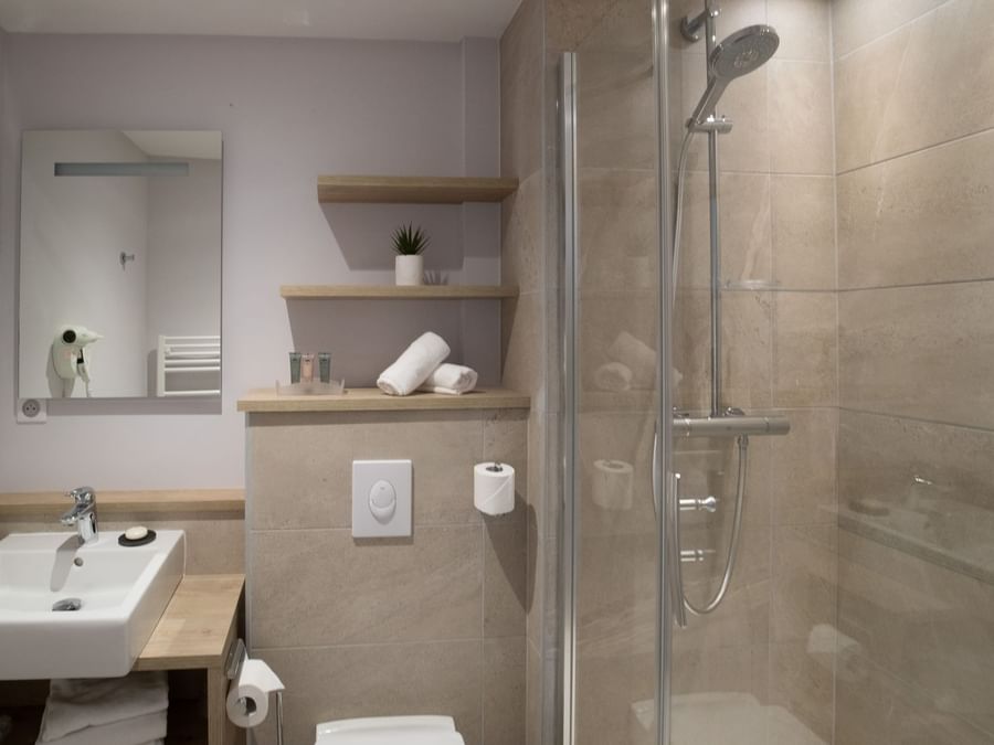 Bathroom vanity in bedrooms at Hotel des Marins