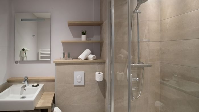 Bathroom vanity in bedrooms at Hotel des Marins