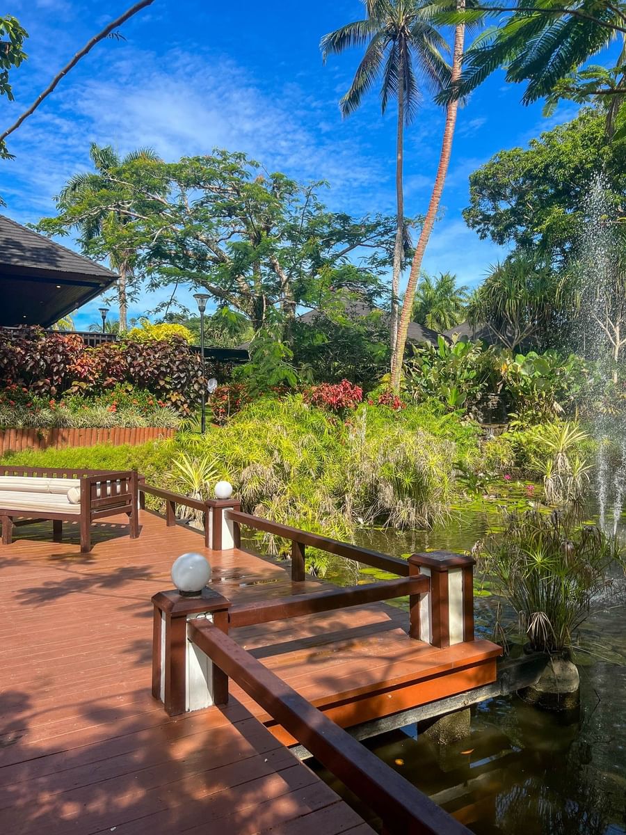 Wooden deck with pond and fountain at The Naviti Resort Fiji.