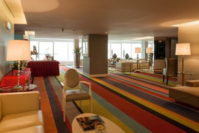 Pre-function area in the Sala Foyer with carpeted floors at Hotel Presidente Luanda
