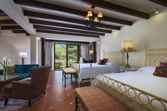 2 Beds & living area in Junior Suite Double at Hotel Atitlan
