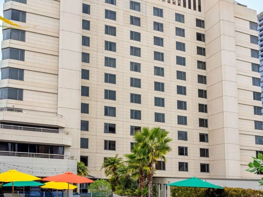 Hotel exterior & colorful umbrellas at Grand Chancellor Adelaide