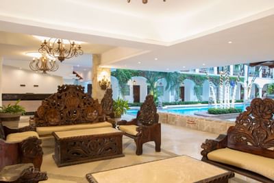 Lobby area near the interior pool at Playa Los Arcos