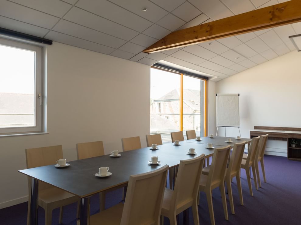 Table arrangement in a meeting room at The Originals Hotels