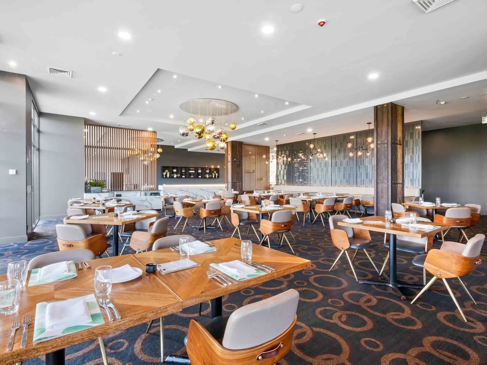 Mercure Kooindah Waters Restaurant with ample tables and chairs with lots of natural light