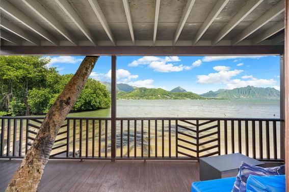 Spacious balcony lounge area in Two-Bedroom Waterfront Cottage at Paradise Bay Resort