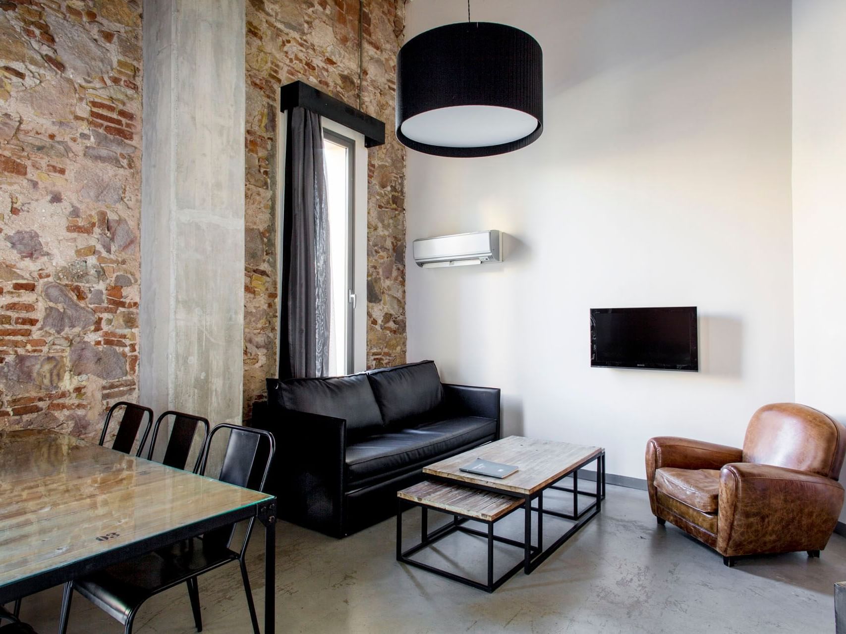 Dining & living area in Family Deluxe at Barcelona Apartment