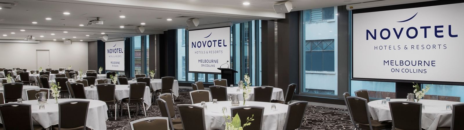 Banquet table setup for event at Novotel Melbourne on Collins