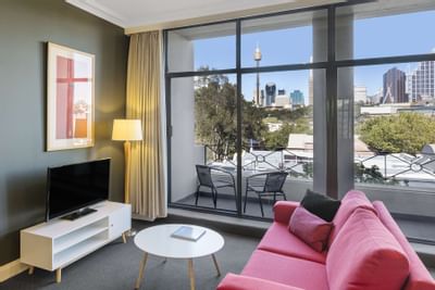 Living area with city view in Studio Apartment at Nesuto Hotels