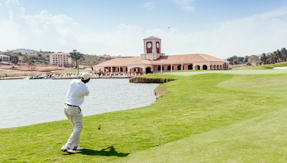 A Man playing golf at Lake Victoria Serena Golf Resort & Spa