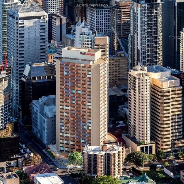 Aerial view of UniLodge Brisbane City among other tall buildings in urban area.