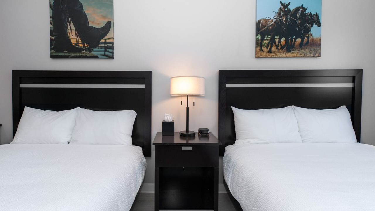 Guest room at Coast Innisfail Hotel with two queen beds side by side