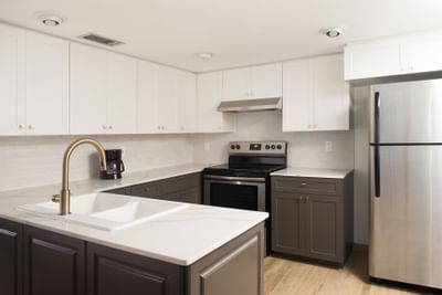 a stove and sink in a kitchen