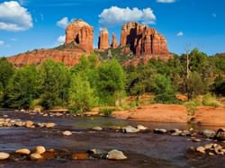 A river that flows among rocks near to mountains