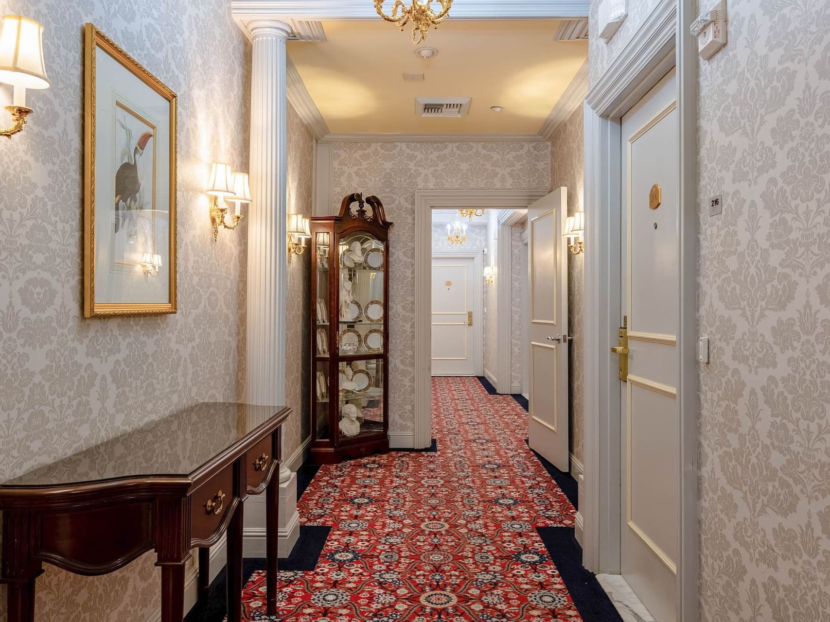 a case of glass plates in the hallway of a hotel