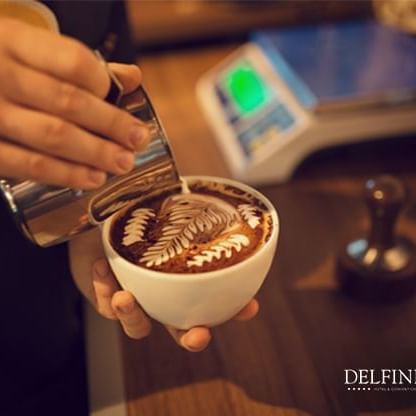 Coffee latte at a coffee shop in Lima at Delfines Hotel