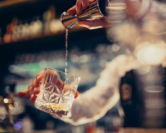 Bartender making a cocktail in a bar at Buenaventura Grand