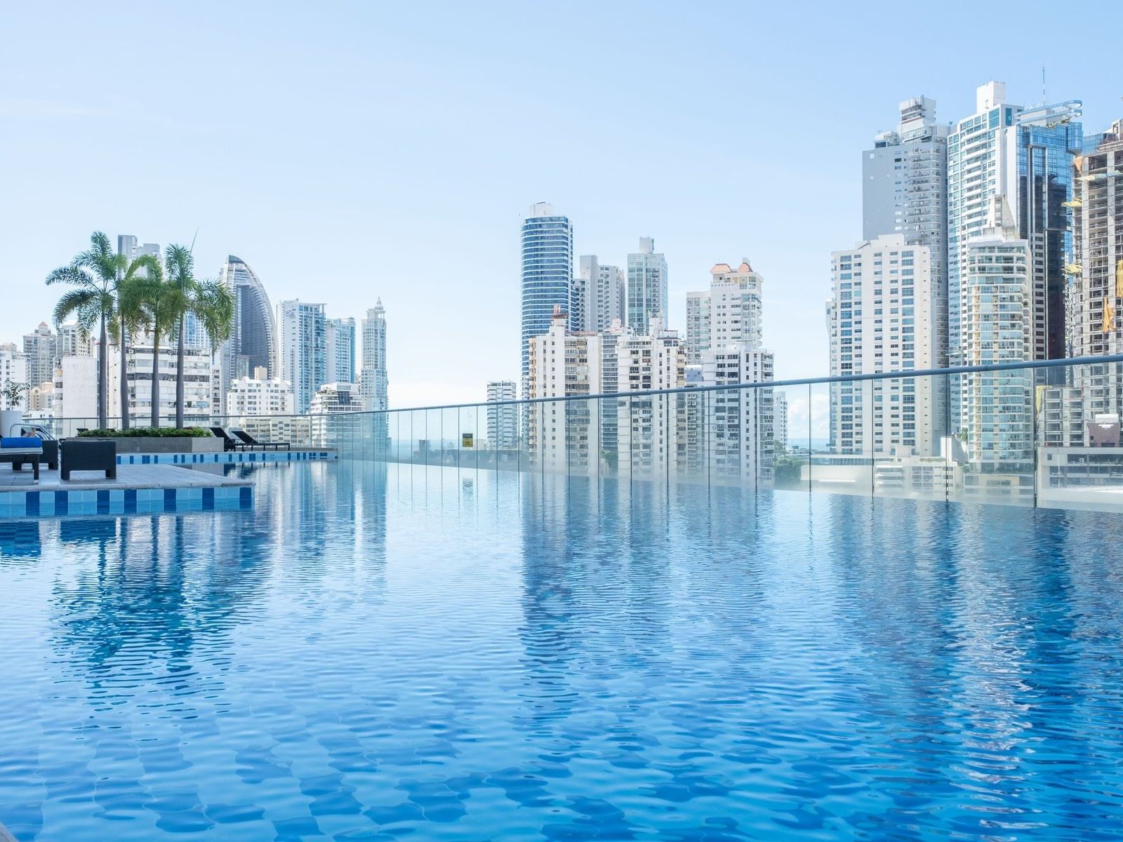 An infinity pool in Float Bar with city view at Megapolis Hotel Panama