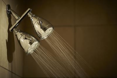 Close-up of shower heads in Deluxe King Room at Kinzie Hotel