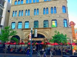 Exterior view of Fork restaurant and people gathering outside near Hotel 43