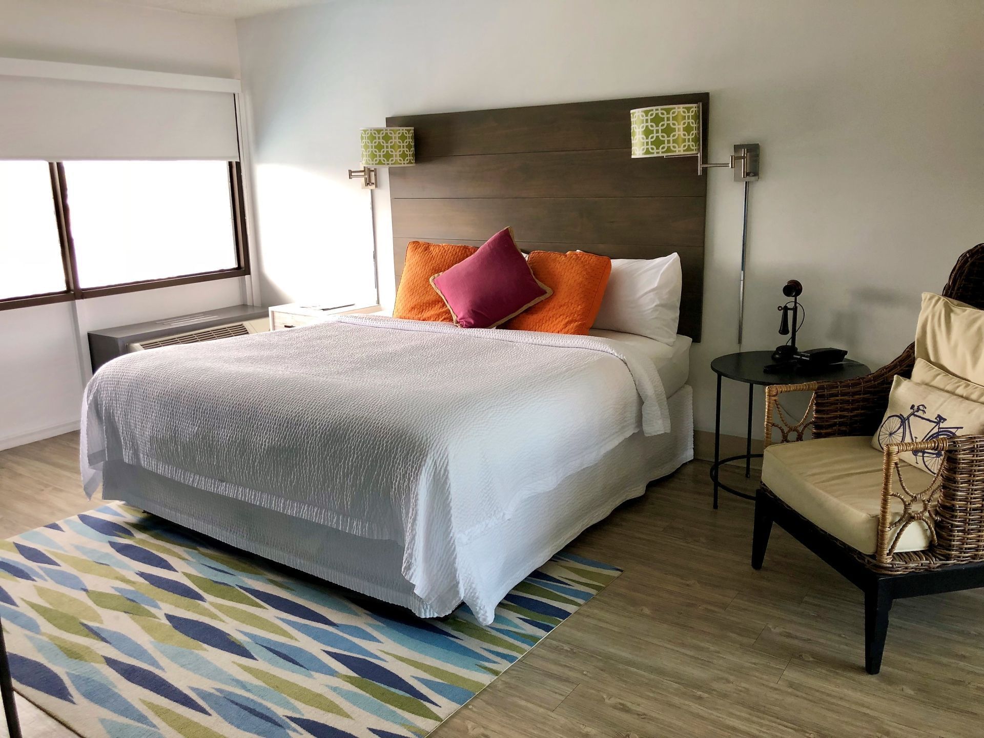 King bed suite with open windows at Block Party Hotels