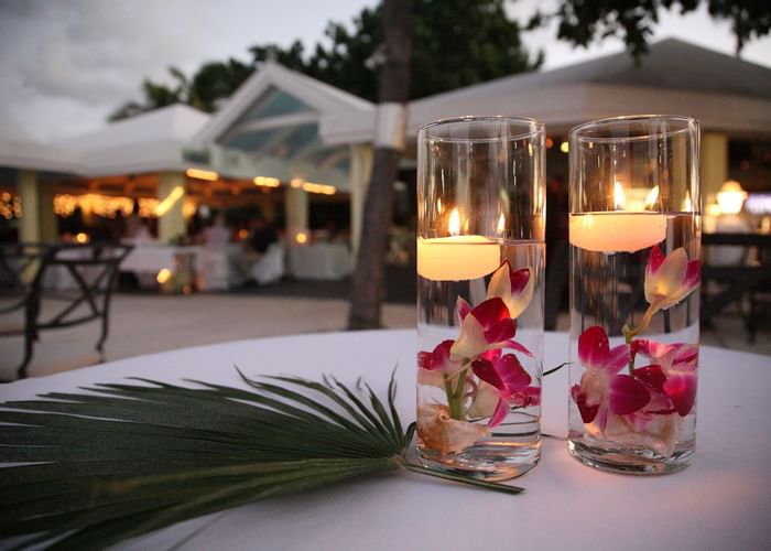 Centerpieces with floating candles and palm leaf at Tamarind Re