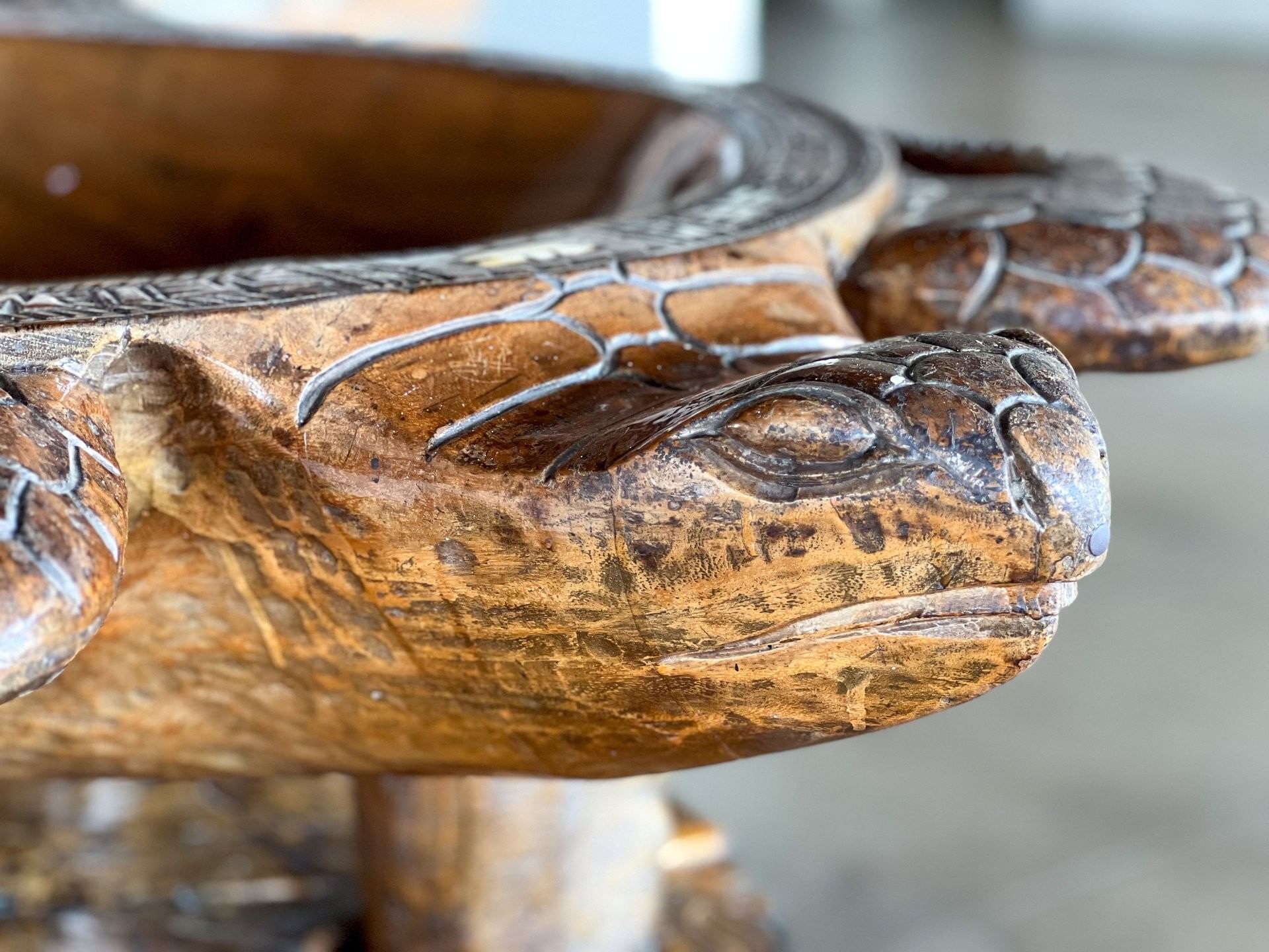 Close-up of a detailed, hand-carved wooden sea turtle bowl, showcasing local craftsmanship at TokaToka Resort Nadi Fiji