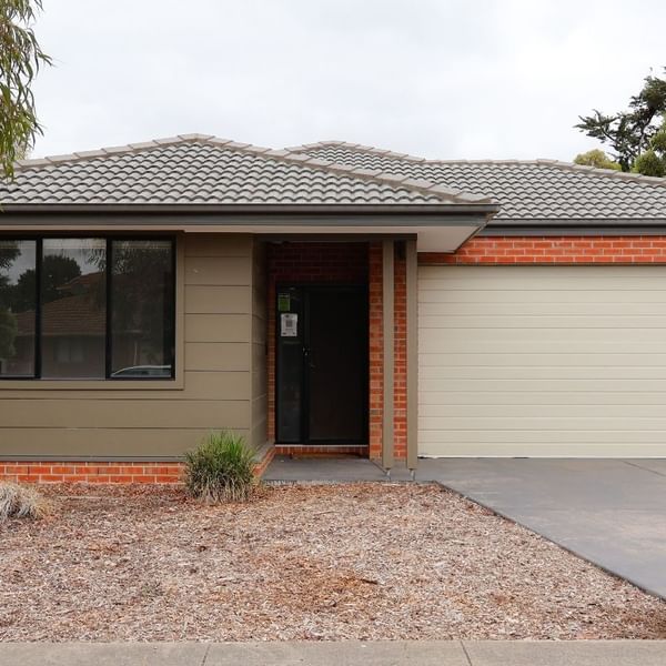 Front view of La Trobe University Regional Housing - Ballarat with garage and driveway.