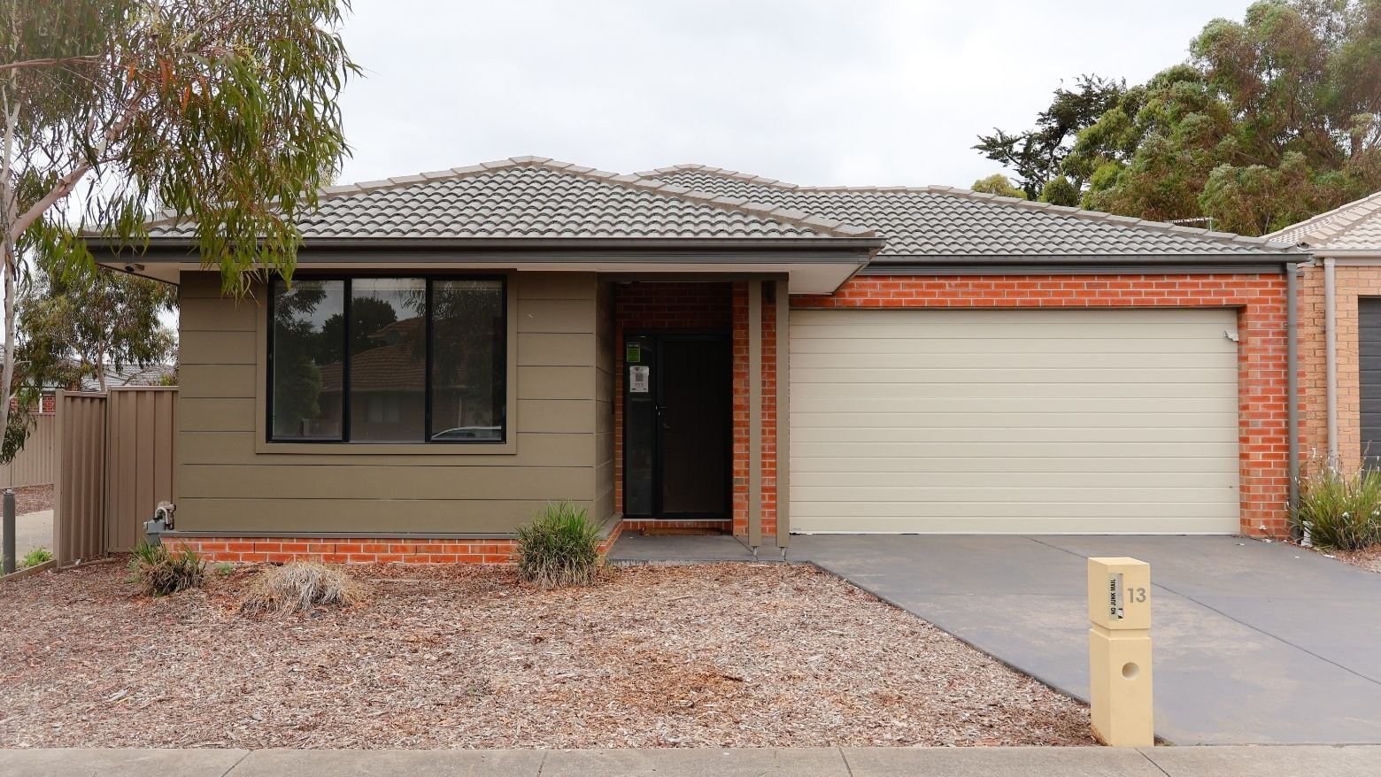 Front view of La Trobe University Regional Housing - Ballarat with garage and driveway.