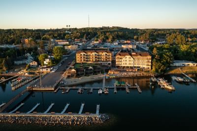View of Chase on the Lake from above the lake showcasing the property and its piers. 