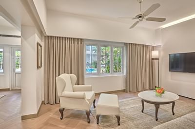 Bedroom area in Deluxe Poolside suite at Goodwood Park Hotel