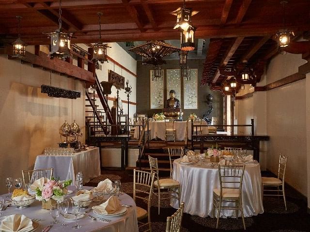 multi-level room with round tables and chairs