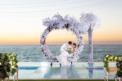Loving couple near the sea view at Playa Los Arcos