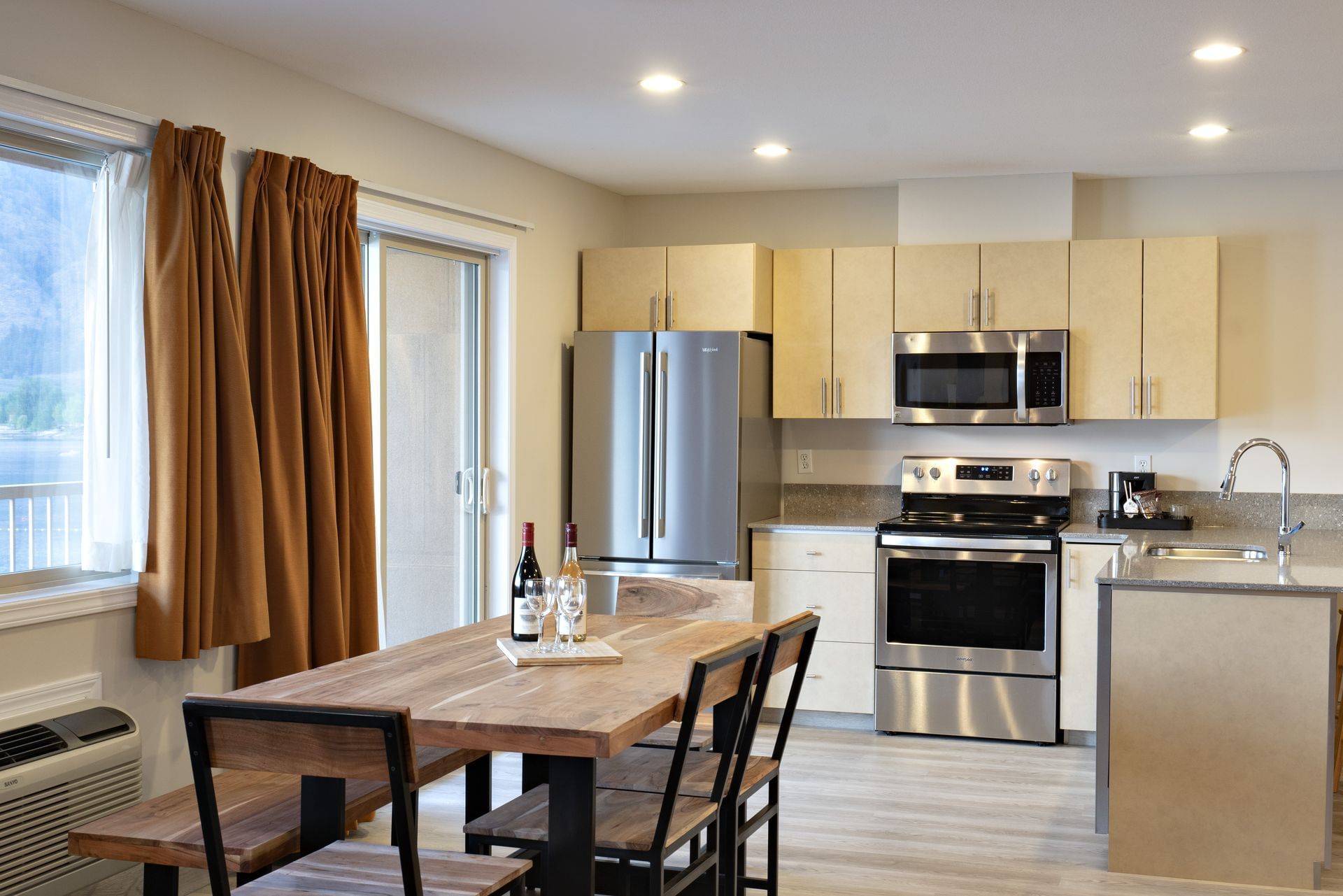 Dining table and kitchen in hotel suite