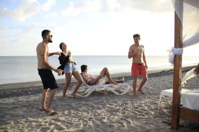 A group spending time on the beach at Playa Blanca Beach Resort