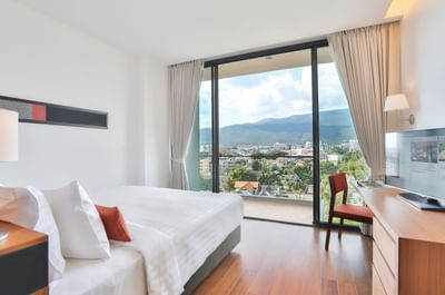 King bed, work desk with TV & balcony view in Superior Premium room at Eastin Hotels