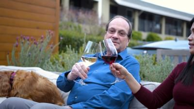 Adult couple toasting wine outdoors at The Nest Palo Alto